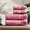 Mekani tamno roza peškiri složeni na stol, idealni za kupatilo ili kao poklon, od visokokvalitetnog pamuka za udobnost i dugotrajnost.
